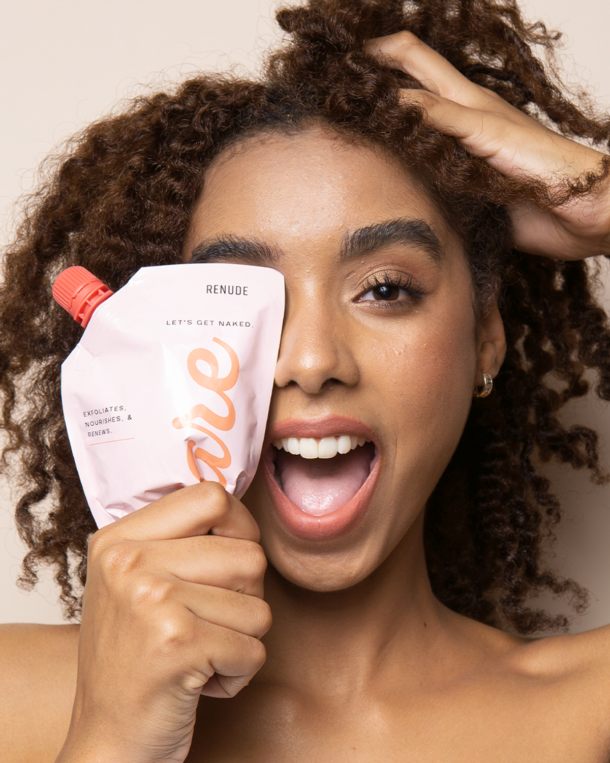 Using Renude BARE body scrub during bath routine